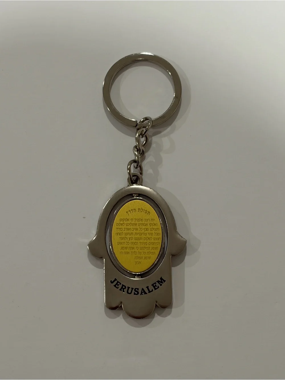 Jerusalem key chain with a Hamsa hand design with a Traveler's prayer.